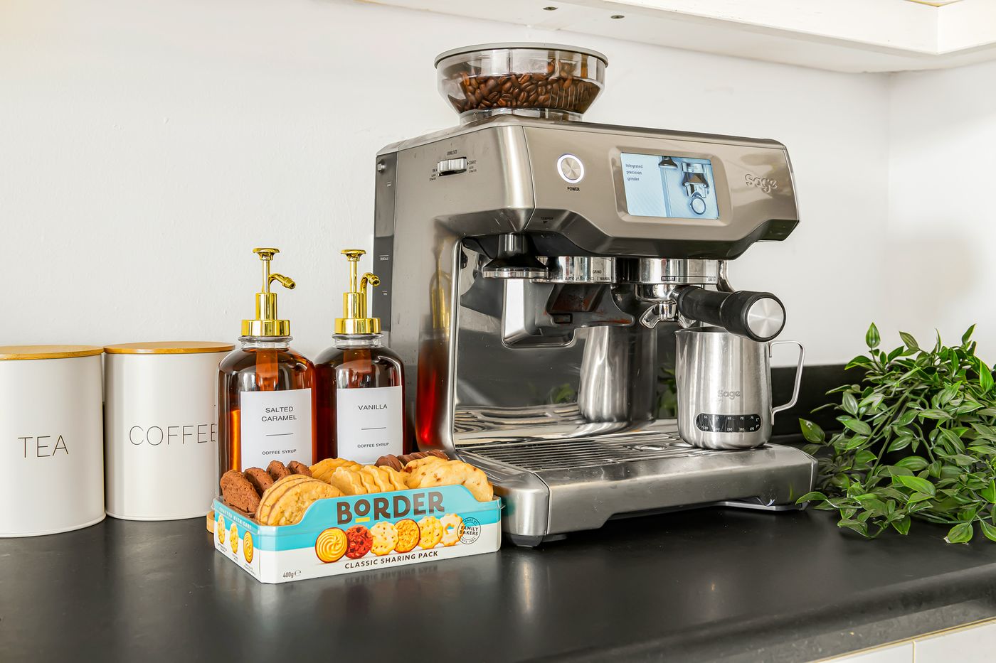 The Sage Barista espresso bar with coffee canisters and biscuits